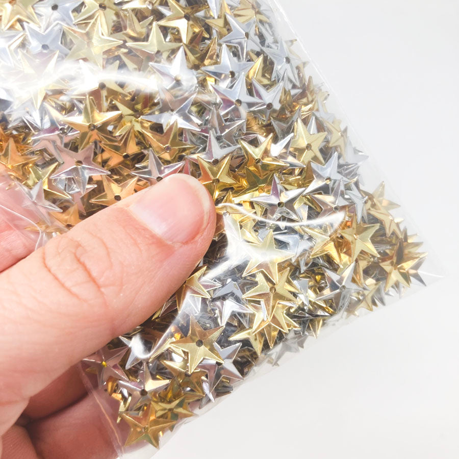 Bundle of silver and gold star sequins