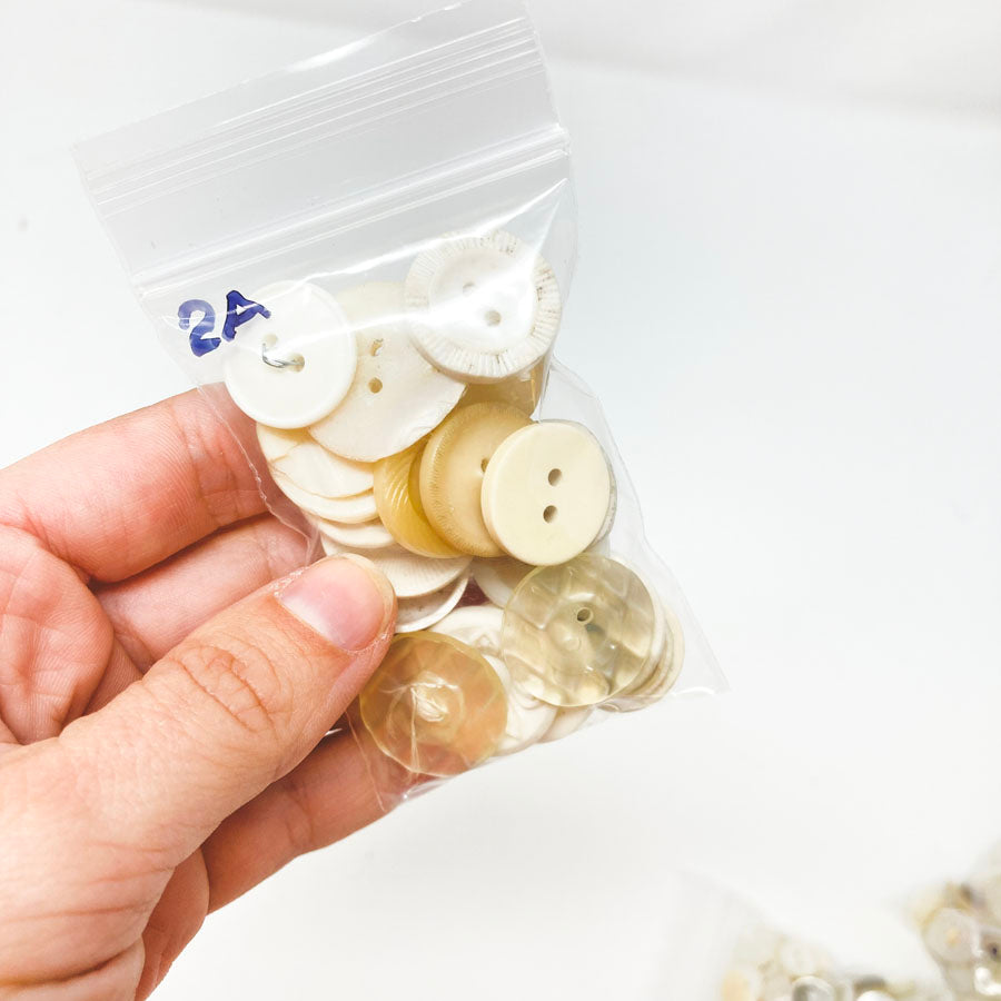 2 Series: Small Bag of Mixed Clear & White Buttons