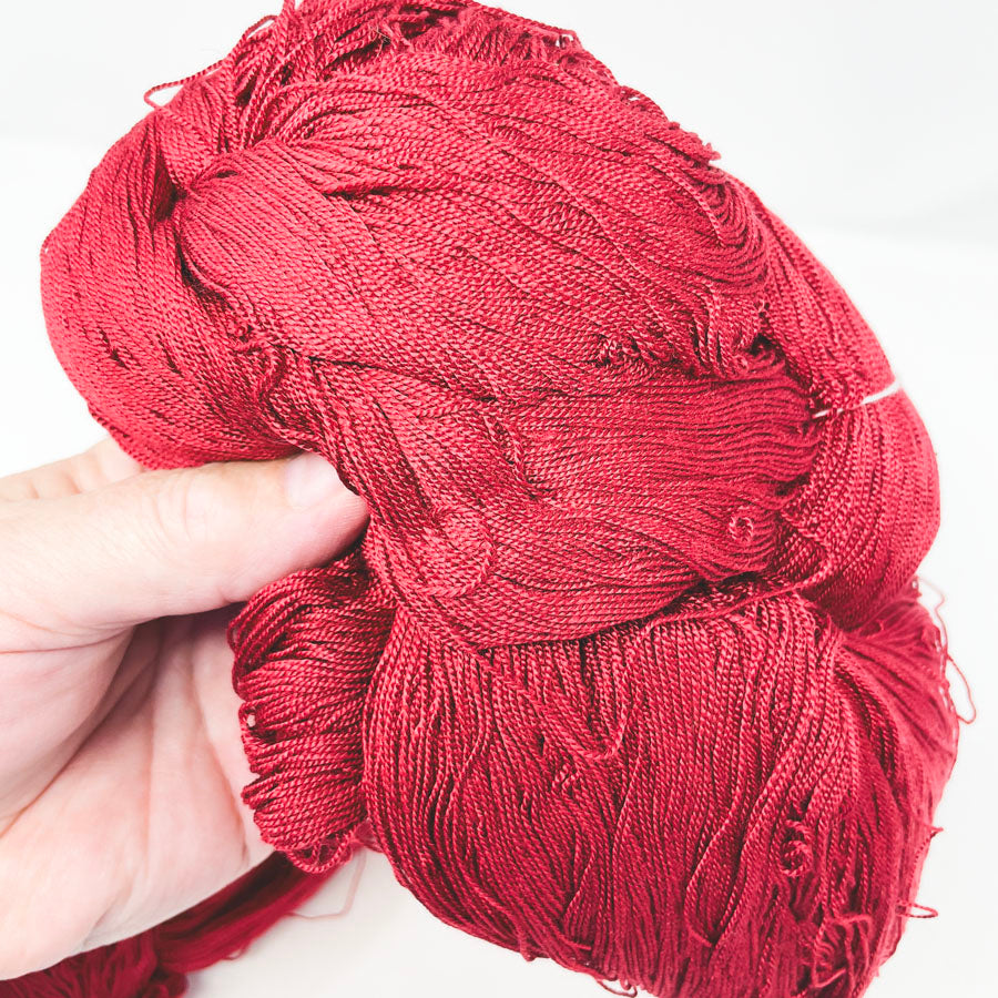 Flanked Burgundy Rayon Yarn Bundle