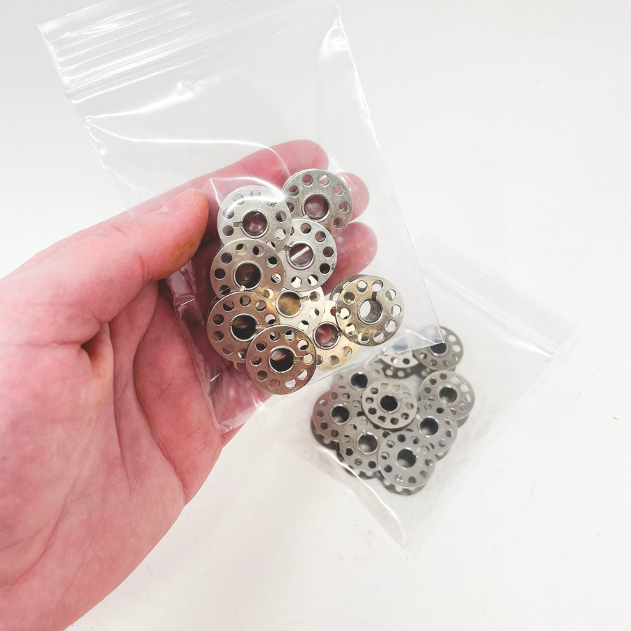 9 Metal Bobbins