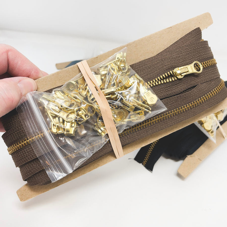 Metal Continuous Zipper Lengths with Gold Pulls