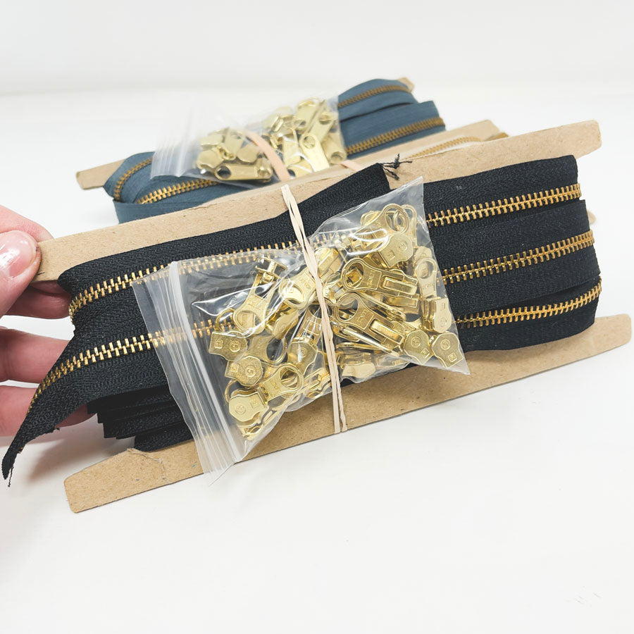 Metal Continuous Zipper Lengths with Gold Pulls
