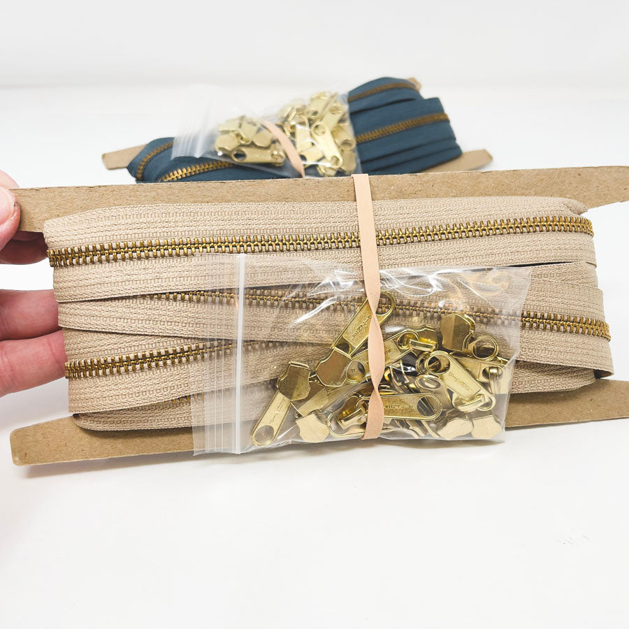 Metal Continuous Zipper Lengths with Gold Pulls