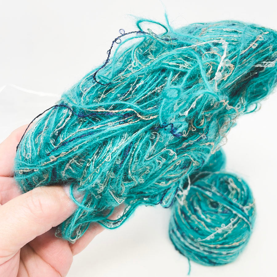 Bundle of Turquoise and Gold Yarn