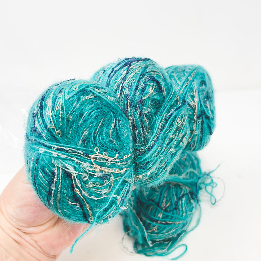 Bundle of Turquoise and Gold Yarn