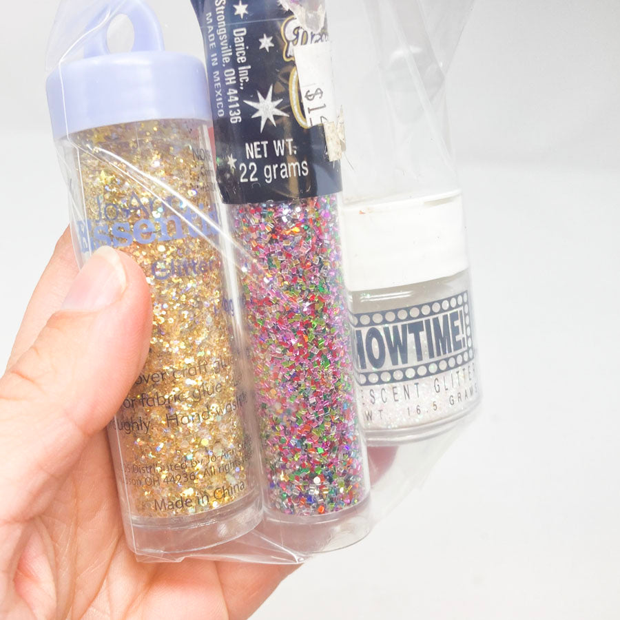 Gold, White, and multicolored bag of glitter