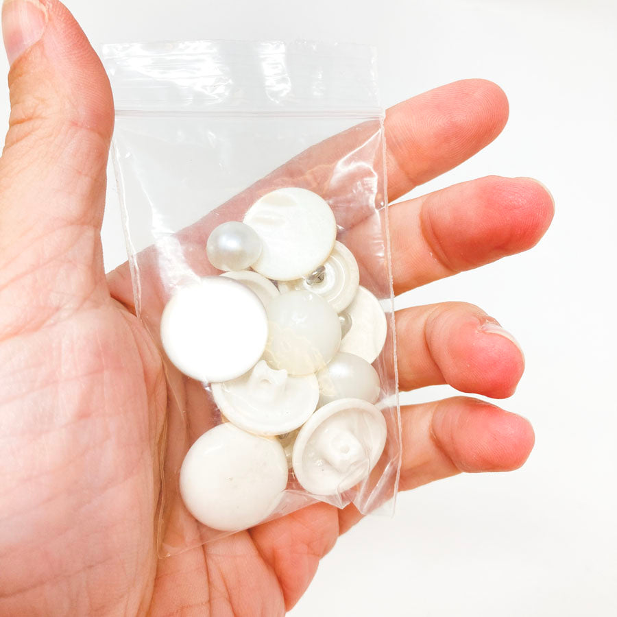 Small Bag of White Plastic Shank Buttons