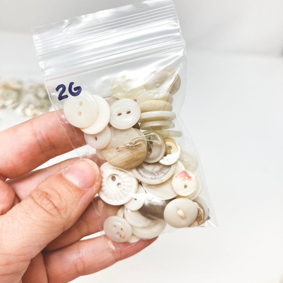 2 Series: Small Bag of Mixed Clear & White Buttons