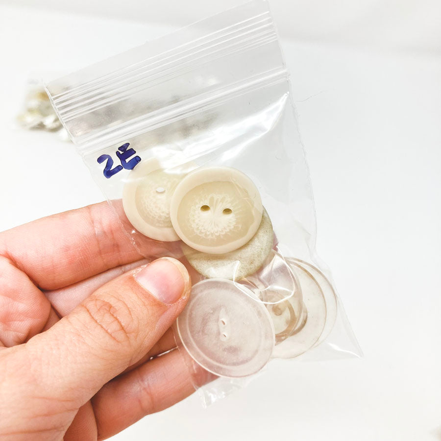 2 Series: Small Bag of Mixed Clear & White Buttons