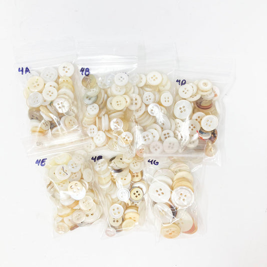 4 Series: Small Bag of Mixed Clear & White Buttons