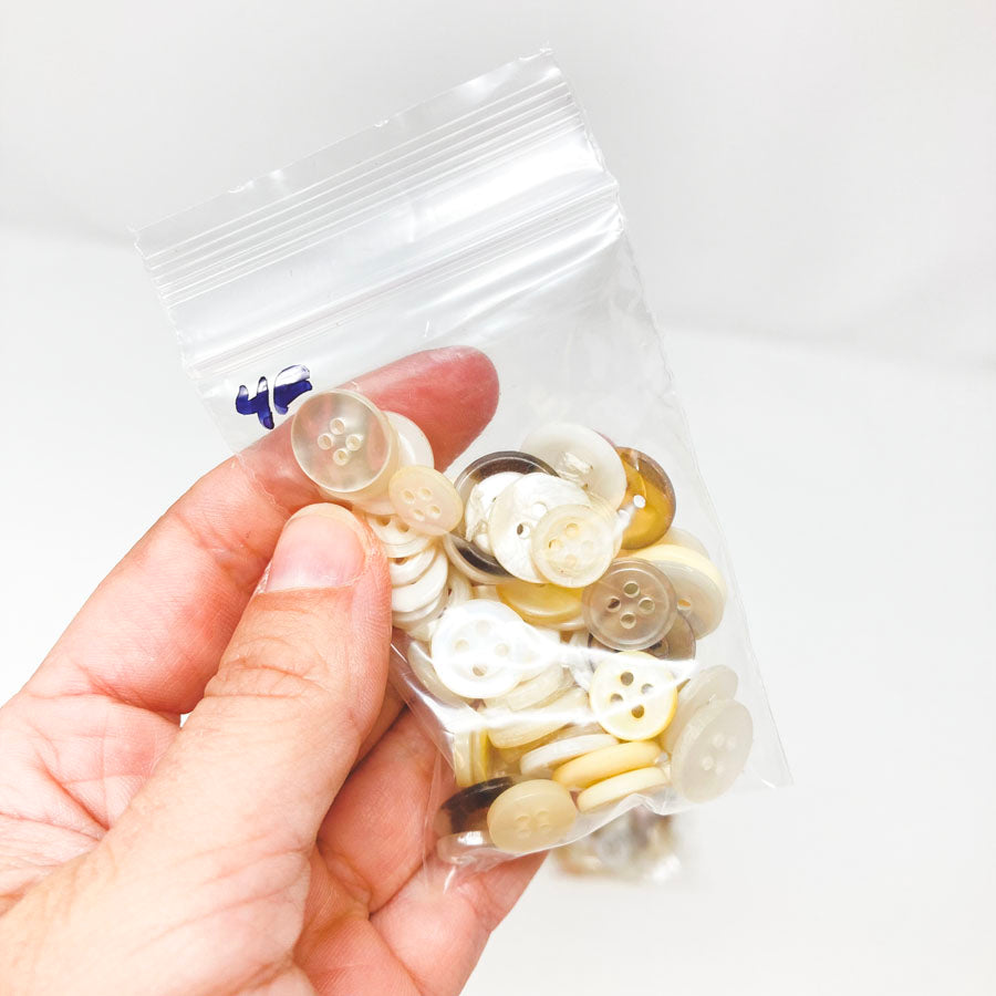 4 Series: Small Bag of Mixed Clear & White Buttons
