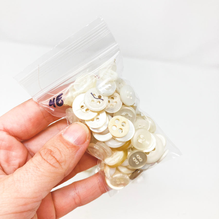 4 Series: Small Bag of Mixed Clear & White Buttons