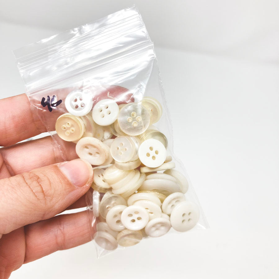 4 Series: Small Bag of Mixed Clear & White Buttons