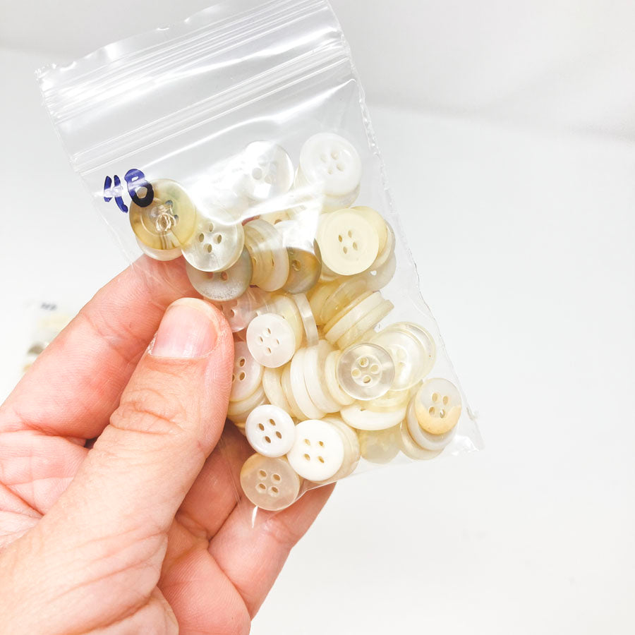 4 Series: Small Bag of Mixed Clear & White Buttons