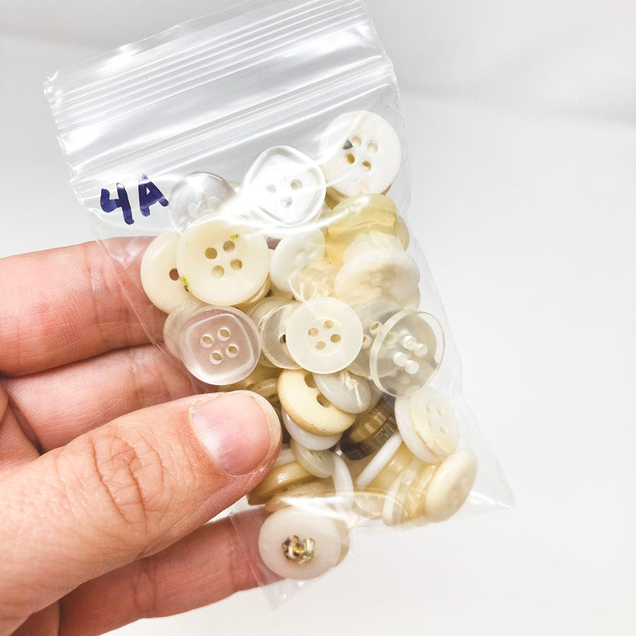 4 Series: Small Bag of Mixed Clear & White Buttons