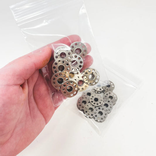 9 Metal Bobbins