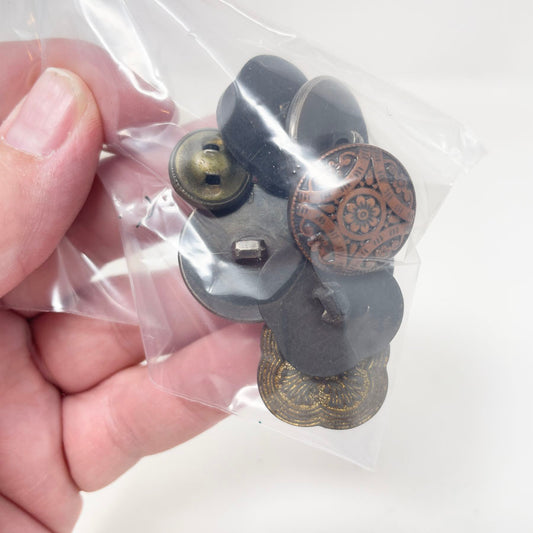 Copper, brass, and gold colored small bag of assorted shank buttons