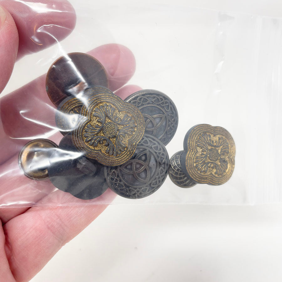 Copper, brass, and gold colored small bag of assorted shank buttons