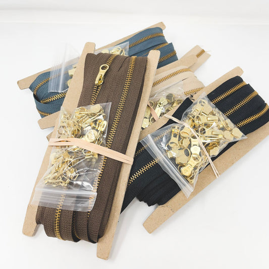 Metal Continuous Zipper Lengths with Gold Pulls